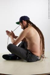 Casual Man White Sitting poses - simple Average Brown Sitting poses - ALL Dreadlocks Standard Photoshoot Academic