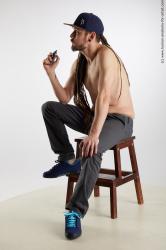 Casual Man White Sitting poses - simple Slim Brown Sitting poses - ALL Dreadlocks Standard Photoshoot Academic
