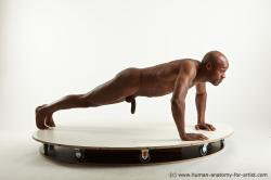 Nude Man Black Laying poses - ALL Slim Bald Laying poses - on stomach Standard Photoshoot Realistic