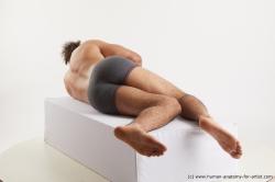 Nude Man Black Laying poses - ALL Muscular Long Laying poses - on side Black Standard Photoshoot Academic