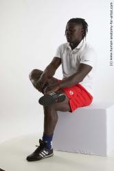 Sportswear Man Black Sitting poses - simple Muscular Black Sitting poses - ALL Dreadlocks Standard Photoshoot Academic