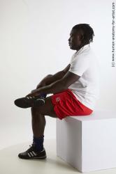 Sportswear Man Black Sitting poses - simple Muscular Black Sitting poses - ALL Dreadlocks Standard Photoshoot Academic