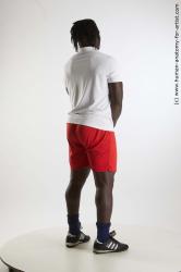 Sportswear Man Black Standing poses - ALL Muscular Black Standing poses - simple Dreadlocks Standard Photoshoot Academic